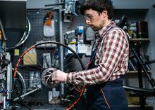 Man working on a bike wheel